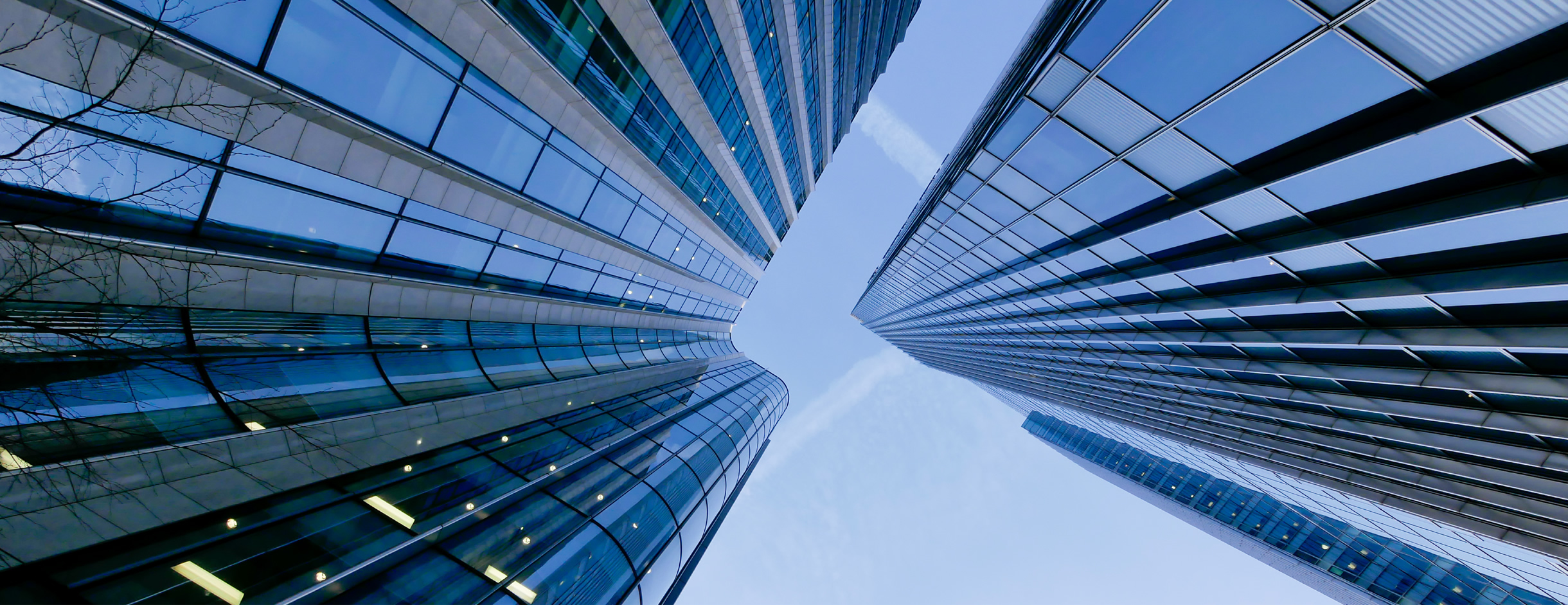 Picture of Skyscrapers looming vertically from street level